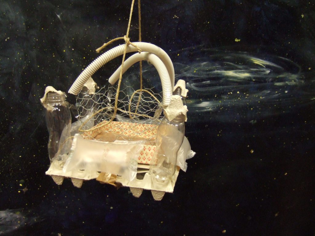 a kind of space plane made from egg carton, strings, wire and fabric