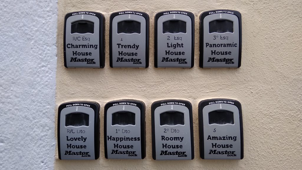 8 small signs on a wall, with different inscriptions