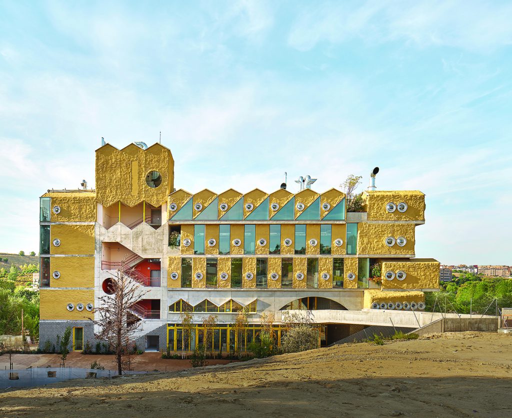 Building in ochre yellow with porthole windows